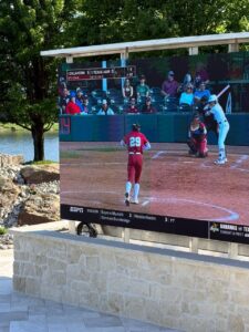 A beautiful poolside LED screen showing a game