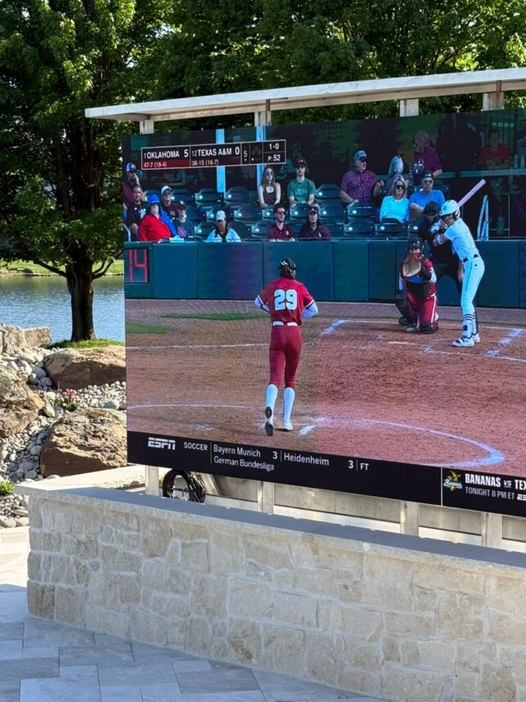 A beautiful poolside LED screen showing a game